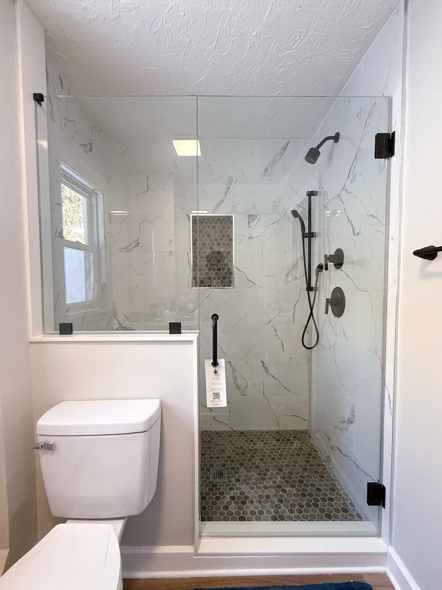Compact shower enclosure with black fixtures