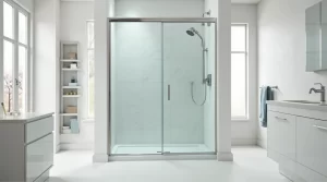 Modern bathroom featuring a sleek frameless glass shower door with elegant tiles and minimalist design.